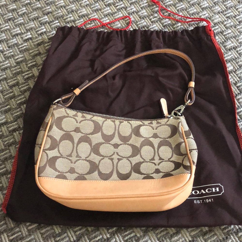 Large wristlet/small purse. Brown coach signature